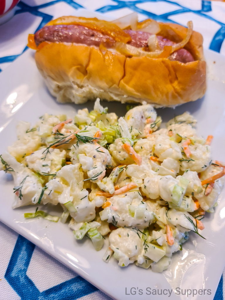 Plate with cauliflower "potato" salad and bratwurst