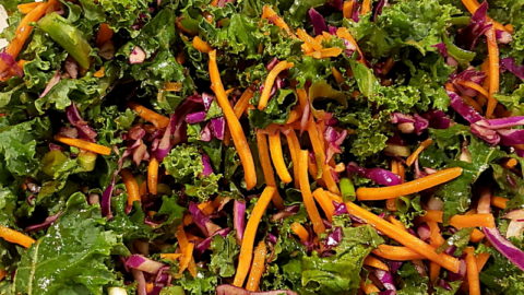 Kale, carrots, and cabbage in a bowl